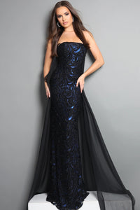Woman wearing a black and blue evening gown against a gray background