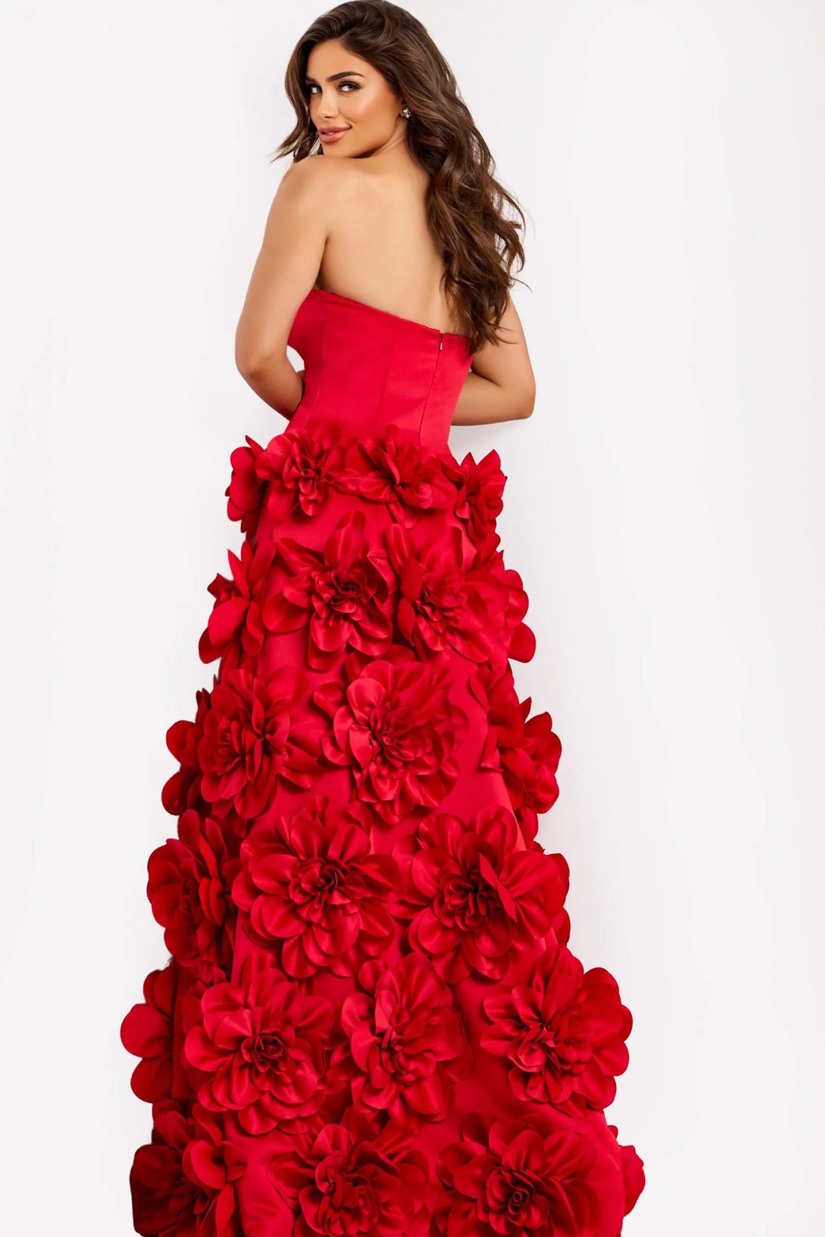 Model wearing Jovani 45661 strapless ball gown featuring a sculpted bodice and dramatic 3D floral skirt.