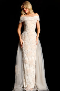 Model wearing Jovani 46034 off-shoulder embellished column gown with removable overskirt and fitted silhouette.