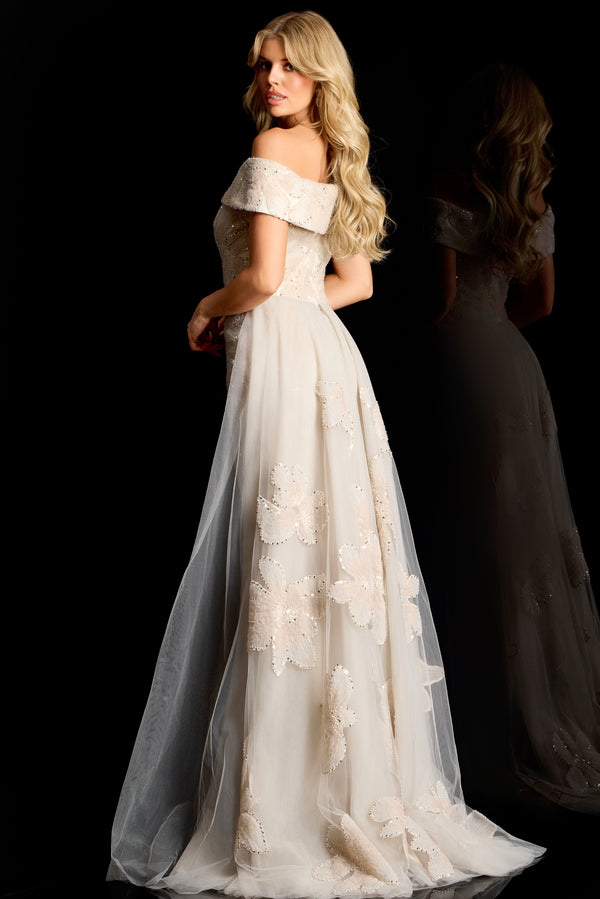 Model wearing Jovani 46034 off-shoulder embellished column gown with removable overskirt and fitted silhouette.