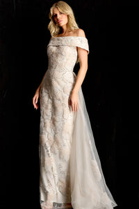 Model wearing Jovani 46034 off-shoulder embellished column gown with removable overskirt and fitted silhouette.