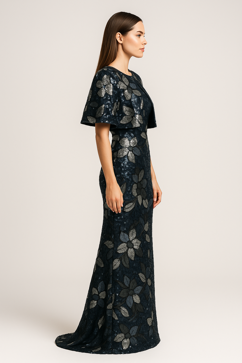 Model wearing Jovani 46431 two-piece column gown with sequin floral detailing, shown strapless and with matching jacket/bolero.  Side View of the dress.