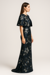 Model wearing Jovani 46431 two-piece column gown with sequin floral detailing, shown strapless and with matching jacket/bolero.  Side View of the dress.