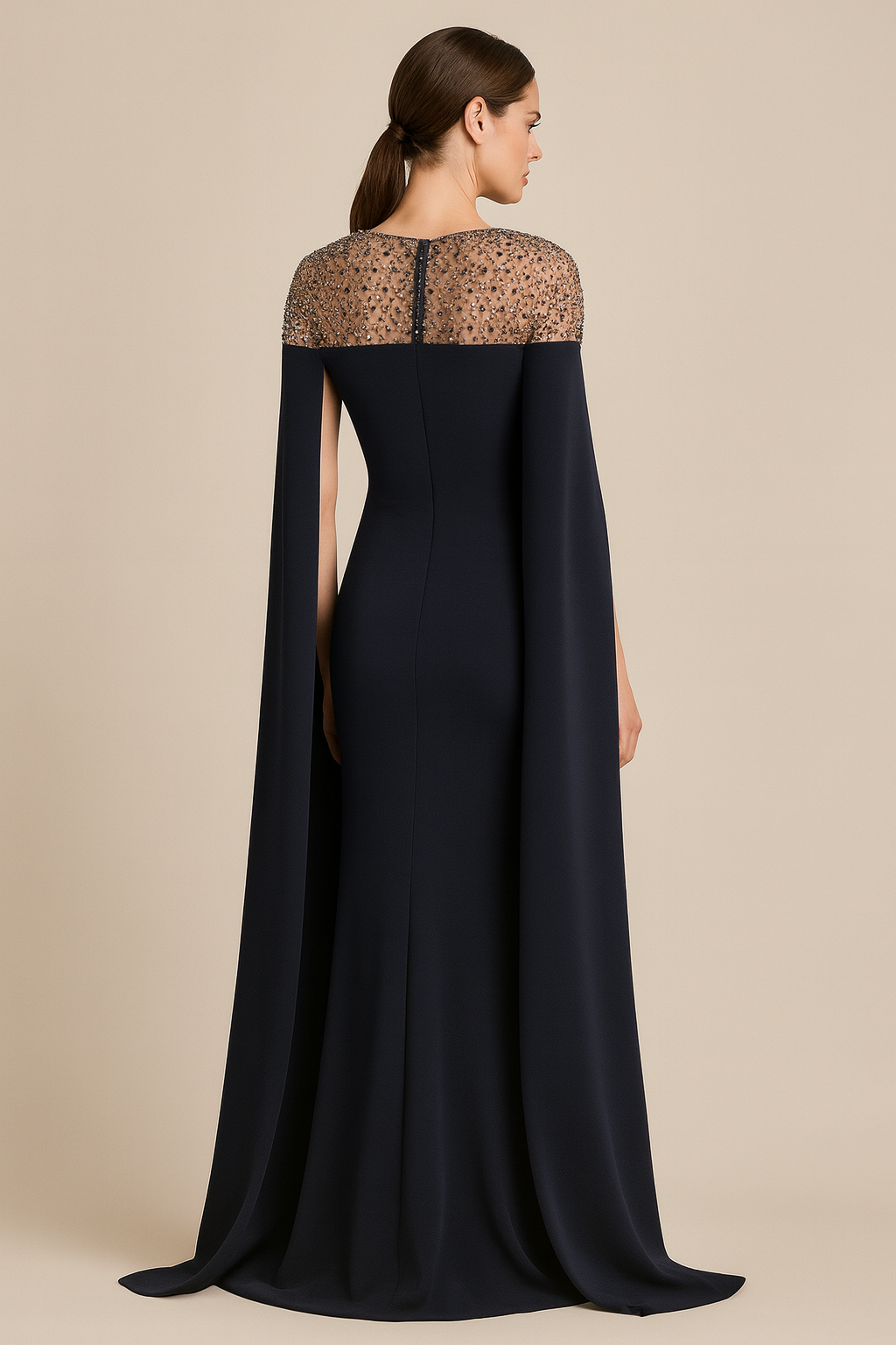 Model wearing Jovani 46522 evening gown with sheer beaded neckline, cape sleeves, and fitted silhouette.