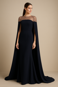 Model wearing Jovani 46522 evening gown with sheer beaded neckline, cape sleeves, and fitted silhouette.