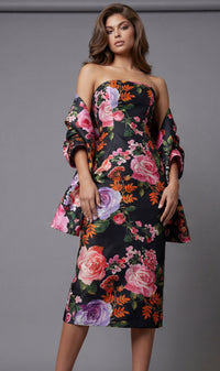 Woman wearing a floral off-shoulder dress against a gray background