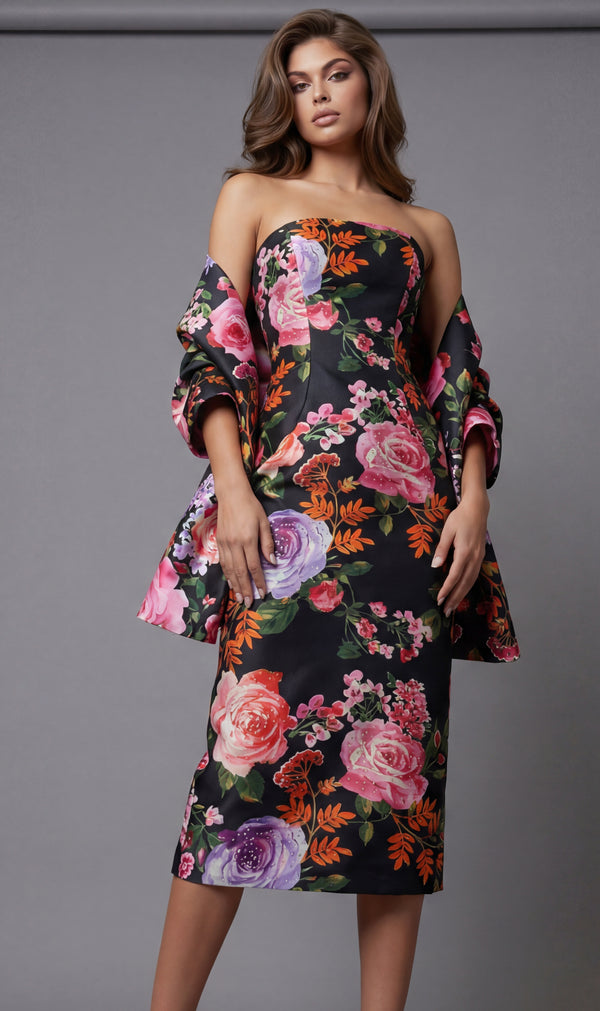 Woman wearing a floral off-shoulder dress against a gray background