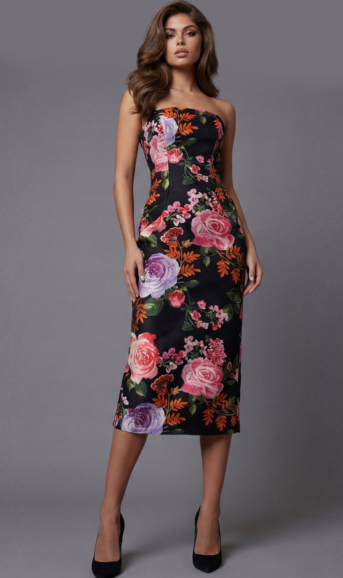 Woman wearing a strapless floral dress against a gray background