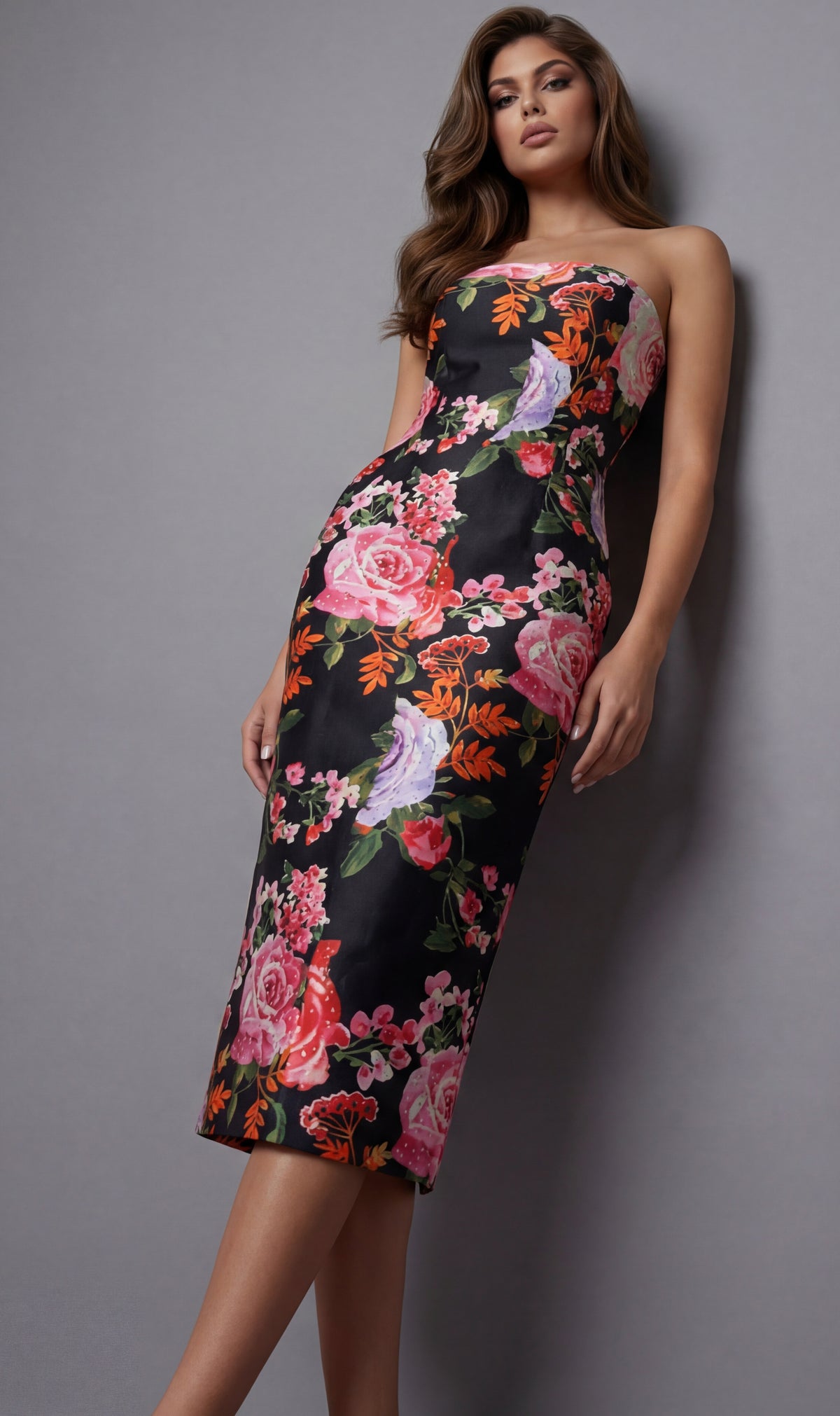 Woman wearing a floral dress against a gray background