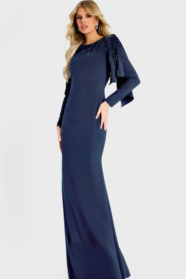 Model wearing Jovani 46738 evening gown featuring a bateau neckline, beaded shoulder detail, long sleeves, and an elegant cape drape.