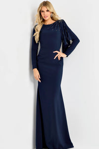 Model wearing Jovani 46738 evening gown featuring a bateau neckline, beaded shoulder detail, long sleeves, and an elegant cape drape.