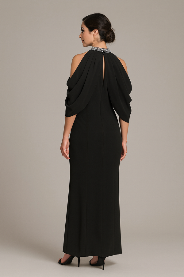 Model wearing Jovani 46742 cold-shoulder gown with embellished high neckline and fitted floor-length silhouette.