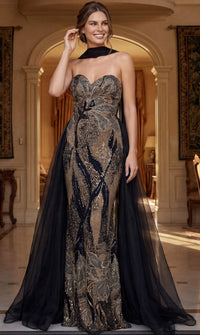 Model wearing Jovani 48709 beaded strapless mermaid gown with dramatic detachable cape.