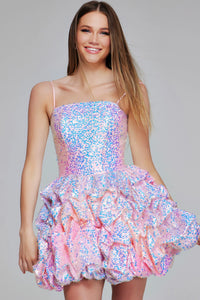 Model wearing a sparkly pink and blue dress on a gray background