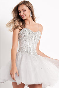 Jovani Tulle Fit and Flare Dress - Style Number K59903. Embrace elegance in this tulle masterpiece with a corset sheer embellished bodice, sweetheart neckline, and spaghetti straps over shoulders. The lace-up back adds allure, making it an ideal choice for graduations and Bat Mitzvahs. Discover this Jovani design at Madeline's Boutique in Toronto and Boca Raton.