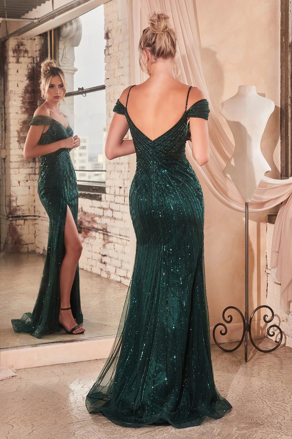La Divine CD0219 Off the Shoulder Sequined Prom Gown - A glamorous prom gown with an off-the-shoulder design, fully beaded & sequined in a linear pattern, featuring a leg slit and sweetheart neckline for a dazzling entrance. The model is wearing the dress in emerald.  Back view of the dress.