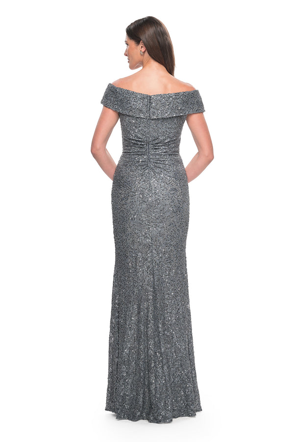 La Femme 31679 Enchanting Beaded Lace Off-the-Shoulder Evening Gown - A breathtaking ensemble featuring intricate beaded lace, off-the-shoulder design, ruching details, and a flattering V neckline for a look of timeless elegance.  The model is wearing the dress in the color gunmetal.  Back View.