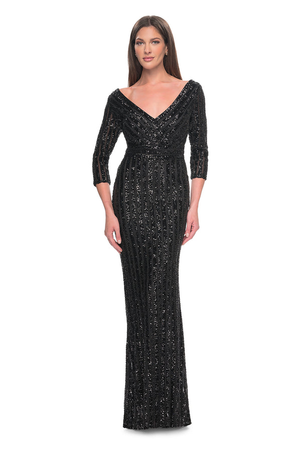 La Femme 31681 Elegant Sequin V-Neck Mother of the Bride/Groom Gown - A vision of elegance with a unique sequin pattern featuring thick lines, V neckline, and three-quarter sleeves for a classic and refined appearance.  The model is wearing the dress in the color black.