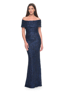 La Femme 31778 Elegant Off-the-Shoulder Lace Evening Gown - A fitted and elegant long dress adorned with exquisite beaded lace, featuring an off-the-shoulder neckline and meticulous ruching.  The model is wearing the dress in the color navy.