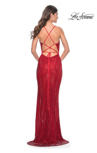 La Femme 31929 - A dazzling square rhinestone embellished fishnet gown with a V neckline, perfect for a glamorous and memorable evening. The model is wearing the dress in the color red.