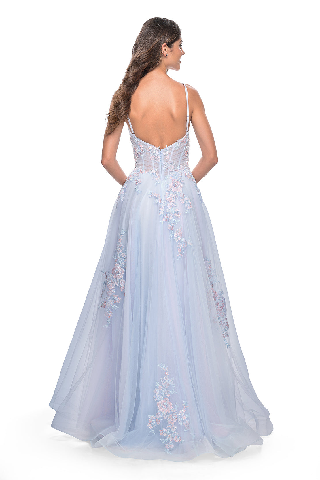 La Femme 31939 Scattered Lace Applique A-Line Prom Gown - An enchanting A-line gown featuring two-color scattered lace applique on tulle, with an illusion waist and boning detail for a magical and captivating prom look. Model is wearing the dress in the color light blue.