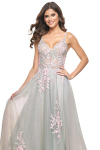 La Femme 31939 Scattered Lace Applique A-Line Prom Gown - An enchanting A-line gown featuring two-color scattered lace applique on tulle, with an illusion waist and boning detail for a magical and captivating prom look. Model is wearing the dress in the color sage.