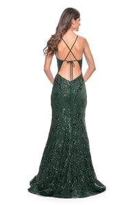 La Femme 31943 Stunning Print Sequin Mermaid Prom Gown - A captivating mermaid gown with a mesmerizing print sequin design, illusion waist, and dramatic open lace-up back. The picture is of the model wearing the dress in emerald.