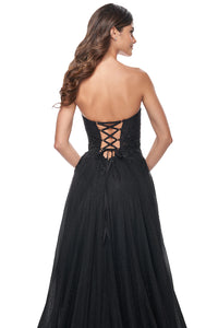 La Femme 32005 Sweetheart Strapless Rhinestone Prom Gown - An enchanting prom gown featuring a sweetheart strapless neckline, rhinestone-embellished tulle, and a ruched illusion bodice with beaded applique detail for a romantic and glamorous look.