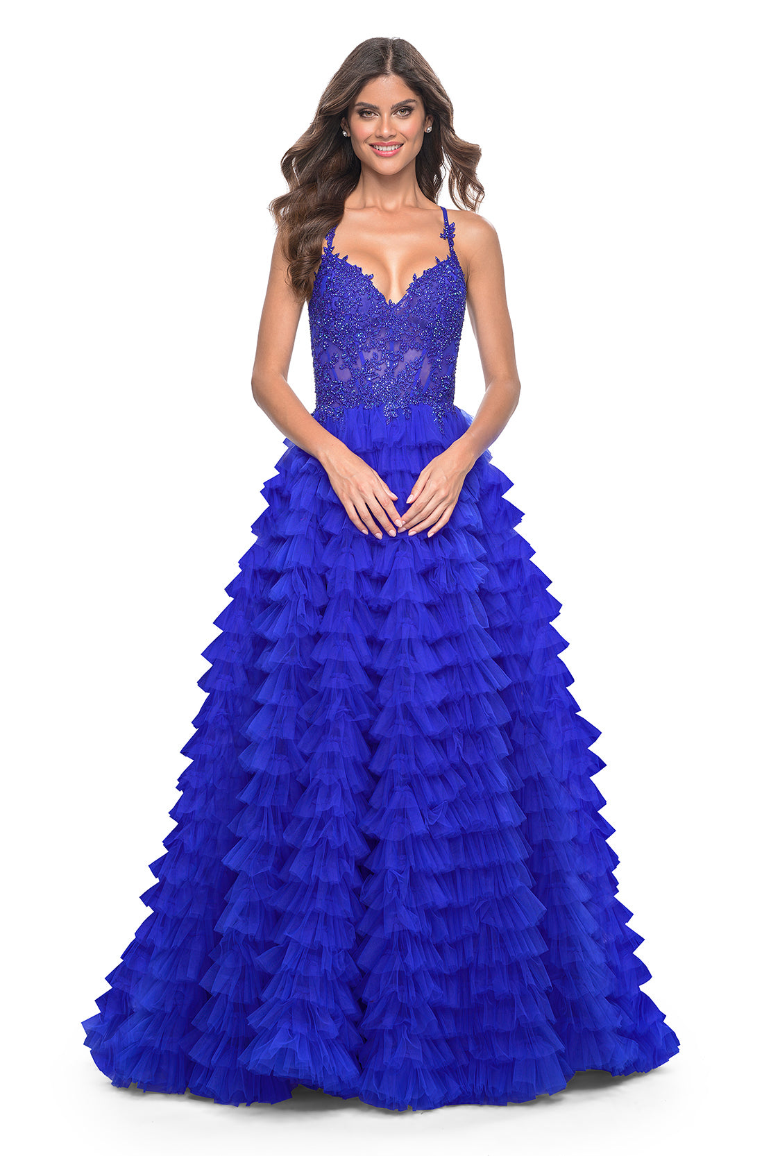 La Femme 32128 Dreamy Ruffle Tulle Tiered Prom Dress - A captivating prom dress featuring a dreamy ruffle tulle tiered skirt, high slit, and intricate lace applique details for an enchanting and sophisticated look. The model is wearing royal blue.