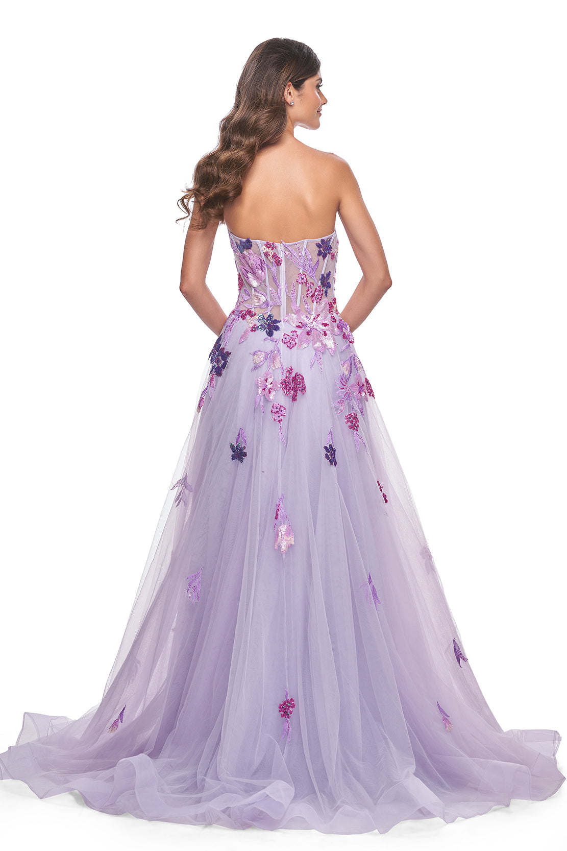 La Femme 32156 Strapless A-Line Tulle Prom and Quinceañera Dress - A captivating A-line tulle dress featuring a strapless design and floral multicolor sequin lace applique details, perfect for making a statement at prom or quinceañera celebrations. The model is wearing the dress in the color Lavender. This is view of the back of the dress.