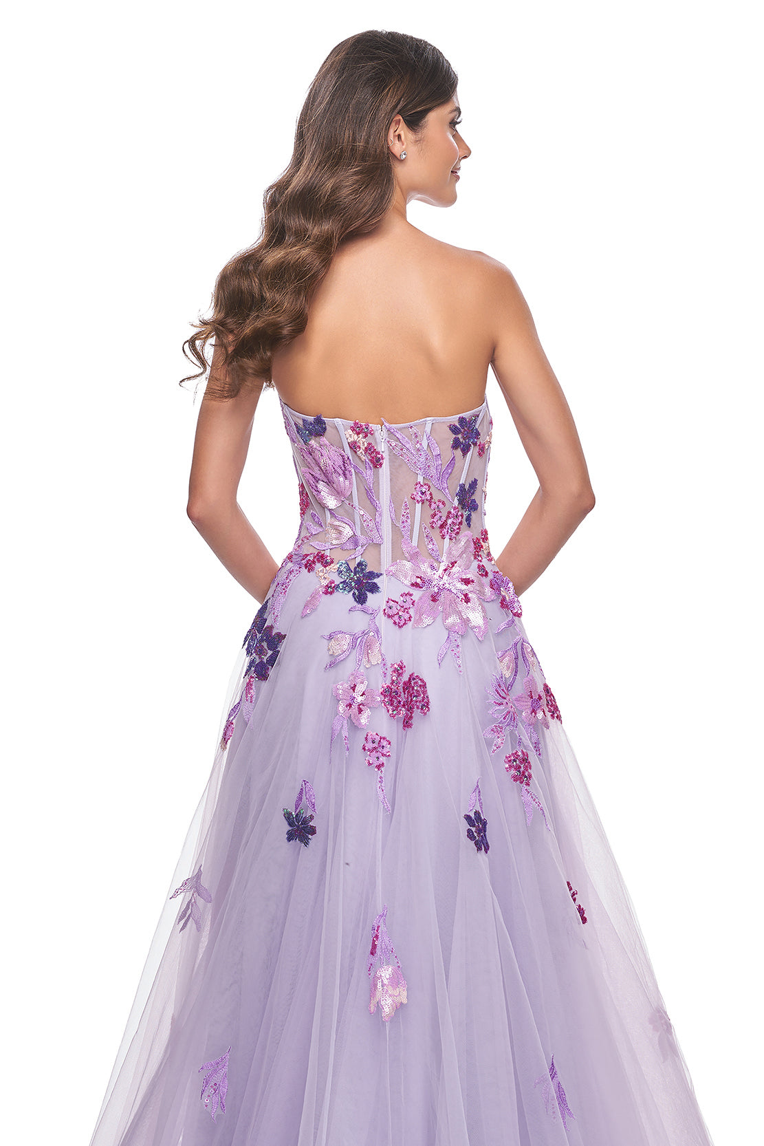 La Femme 32156 Strapless A-Line Tulle Prom and Quinceañera Dress - A captivating A-line tulle dress featuring a strapless design and floral multicolor sequin lace applique details, perfect for making a statement at prom or quinceañera celebrations.  The model is wearing the dress in the color Lavender.  This is view of the back of the dress.