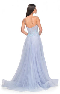 La Femme 32293 - A graceful A-line tulle prom gown featuring a high slit, square neckline, and beaded lace applique for an enchanting look. The model is wearing the dress in light periwinkle.
