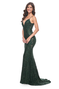 La Femme 32309 Beaded Lace Mermaid Prom Gown - An enchanting prom gown with a beaded lace mermaid silhouette, open lace-up back, and sheer lace panels on both sides. The model is wearing the dress in the color dark emerald.  Side View.