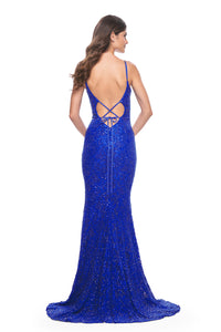 La Femme 32309 Beaded Lace Mermaid Prom Gown - An enchanting prom gown with a beaded lace mermaid silhouette, open lace-up back, and sheer lace panels on both sides.  The model is wearing the dress in the color Royal Blue.