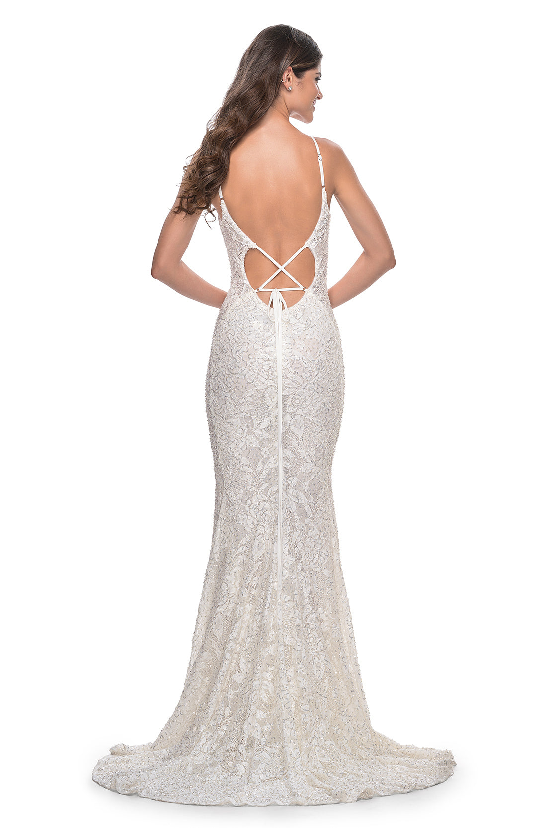 La Femme 32309 Beaded Lace Mermaid Prom Gown - An enchanting prom gown with a beaded lace mermaid silhouette, open lace-up back, and sheer lace panels on both sides. The model is wearing the dress in the color white.