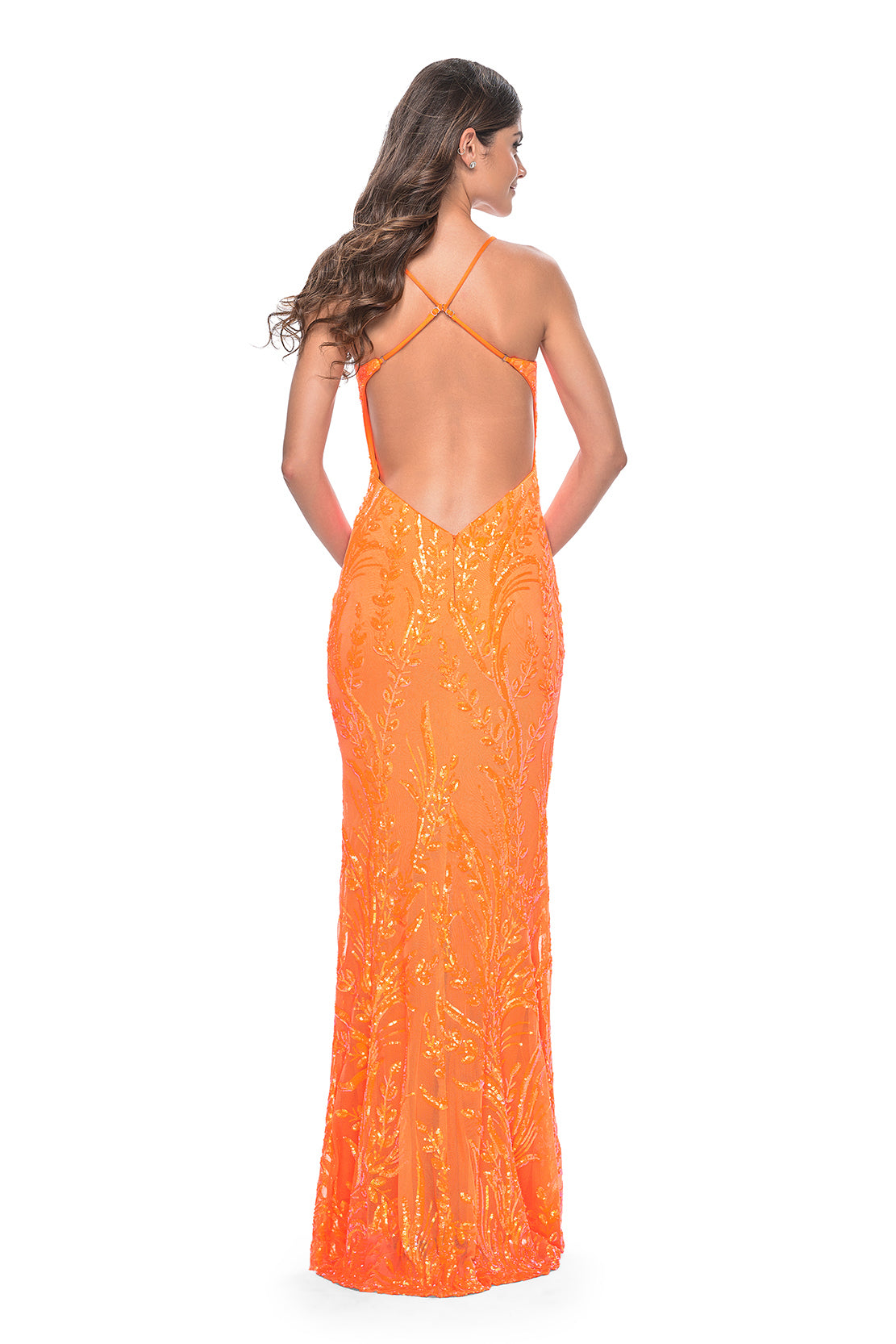La Femme 31944 Leaf Print Sequin Prom Dress - An eye-catching prom dress featuring a print sequin fabric with a leaf design, V neckline, and open back for a unique and captivating look. The model is wearing the dress in the color orange.