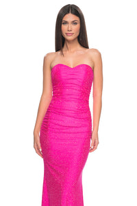 La Femme 32436 Strapless Rhinestone Embellished Prom Gown - A glamorous prom gown with a strapless design, tonal rhinestone embellishments, sweetheart neckline, and a lace-up back for added allure.  Model is wearing neon pink.