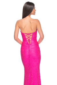La Femme 32436 Strapless Rhinestone Embellished Prom Gown - A glamorous prom gown with a strapless design, tonal rhinestone embellishments, sweetheart neckline, and a lace-up back for added allure.  Model is wearing neon pink.
