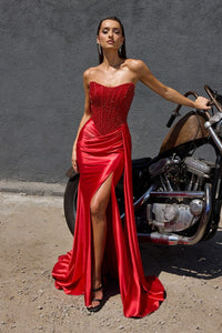 Model wearing Ladivine C170 strapless gown in the color red with rhinestone bodice and a high-slit draped skirt.  Front view of the dress.