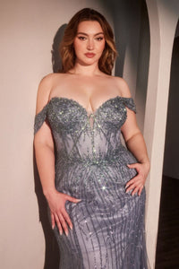 Woman wearing a sparkling off-shoulder gown against a neutral background