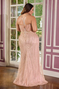 Woman in a moch gold sequin dress standing in a room with purple walls and a window.