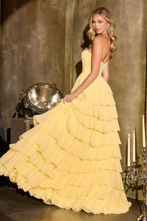 Model wearing Ladivine CD402 strapless sweetheart high-low ball gown with crystal-embellished bust and tiered ruffle skirt.
