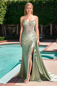 Model wearing Ladivine KV1131 strapless sweetheart gown with embellished bodice, leg slit, and flowing satin sash.
