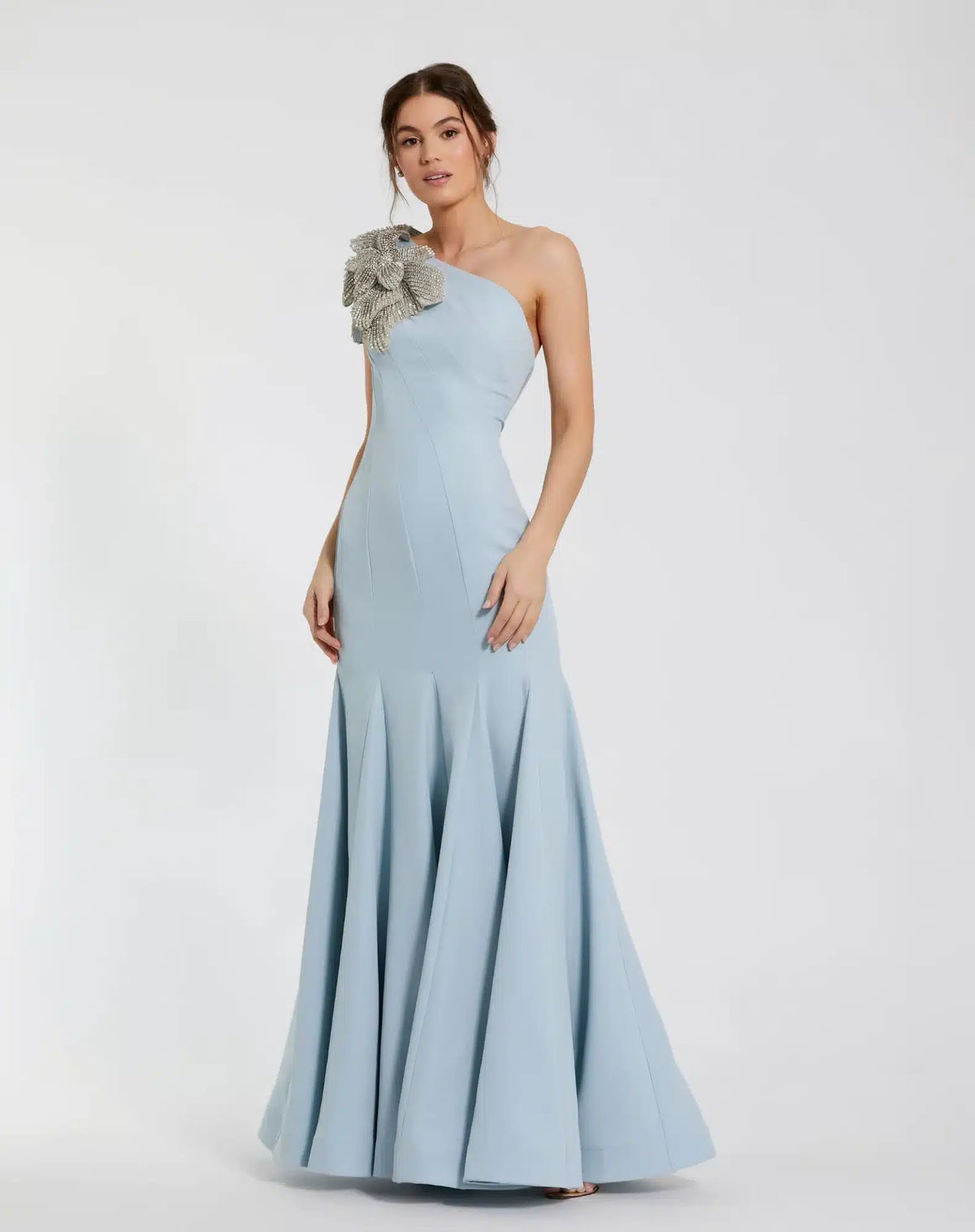 Model wearing Mac Duggal 11810 one-shoulder trumpet gown with flower detail.  Model wearing the dress in the color powder blue.  Front view.