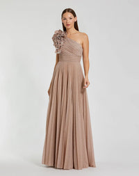 Model wearing the Mac Duggal 11879 one-shoulder gown with a 3D ruffled shoulder detail, pleated waistband, and flowing A-line skirt.