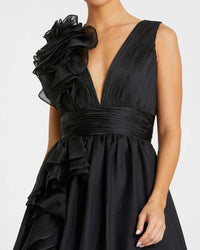 Model wearing Mac Duggal 48856 chiffon gown with V-neckline, ruffle shoulder detail, and flowing skirt.  Model wearing the color black.  Front view.  Close up.