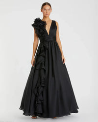 Model wearing Mac Duggal 48856 chiffon gown with V-neckline, ruffle shoulder detail, and flowing skirt.  Model wearing the color black.  Front view.