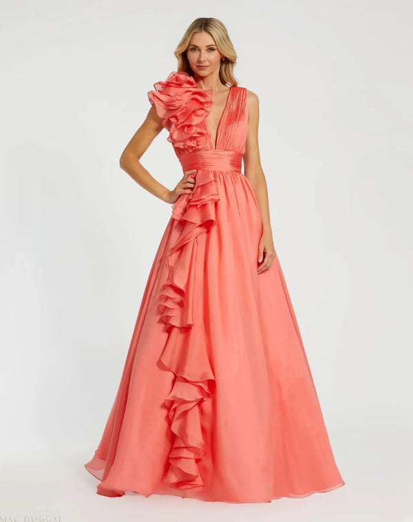Model wearing Mac Duggal 48856 chiffon gown with V-neckline, ruffle shoulder detail, and flowing skirt.  Model wearing the color coral.  Front view.