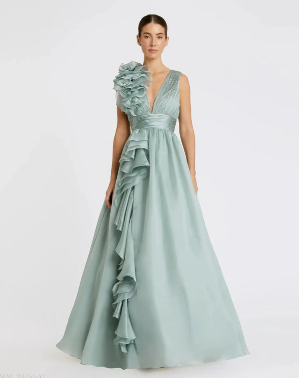 Model wearing Mac Duggal 48856 chiffon gown with V-neckline, ruffle shoulder detail, and flowing skirt.  Model wearing the color mint.  Front view.