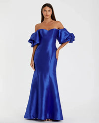 Model wearing Mac Duggal 50677 off-the-shoulder satin gown with puff sleeves, mermaid silhouette, and sweeping train.  Model is wearing the color royal blue. Front view.